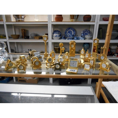 268 - A good collection of miniature clocks, mainly brass, 1 Border Fine Arts, which has a few minor chips... 