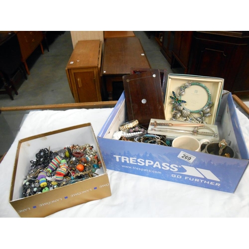 269 - 2 boxes of costume jewellery including an old box, letter openers etc.