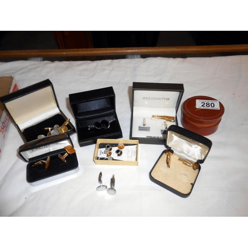 280 - A quantity of cufflinks including a silver set plus a tie pin