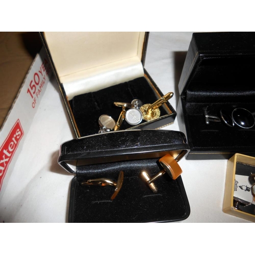 280 - A quantity of cufflinks including a silver set plus a tie pin