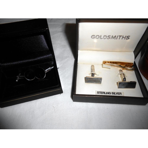 280 - A quantity of cufflinks including a silver set plus a tie pin