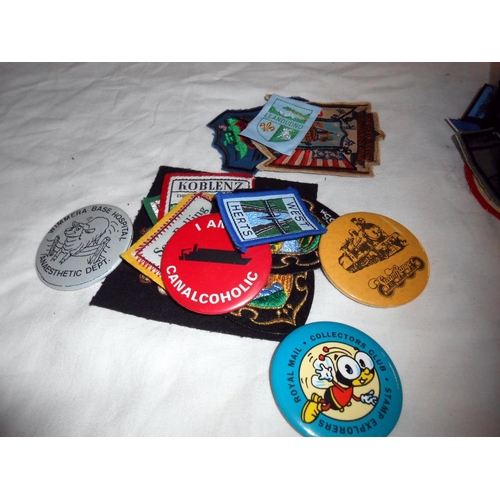 282 - A box of sew on patches including girl guides, plus pin badges, small books (Scottish songs, The Spa... 