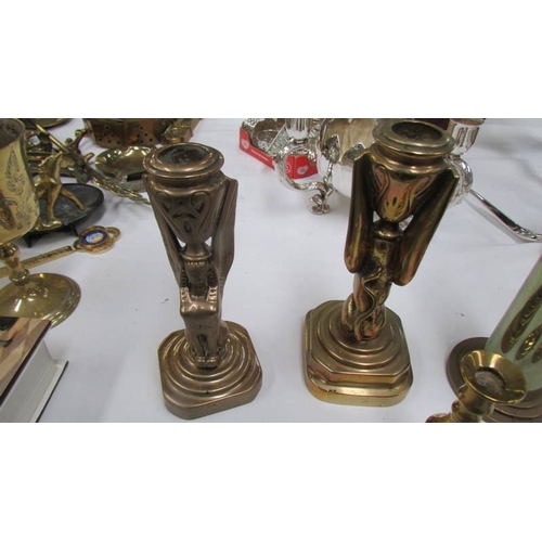 1132 - A pair of Heavy bronze anvils on stands, a pair of bronze candlesticks, A trench art vase, a pair of... 