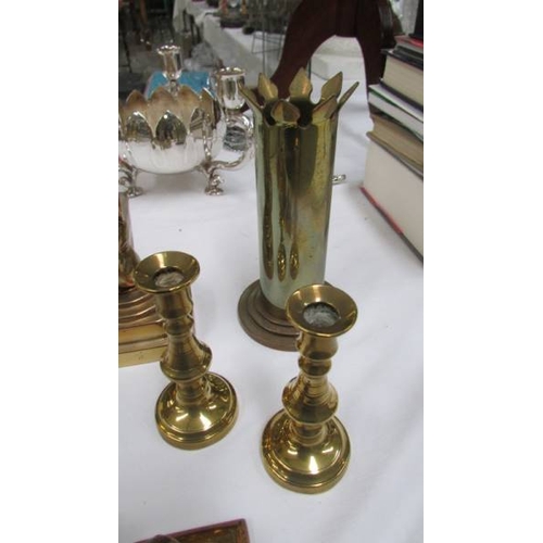 1132 - A pair of Heavy bronze anvils on stands, a pair of bronze candlesticks, A trench art vase, a pair of... 