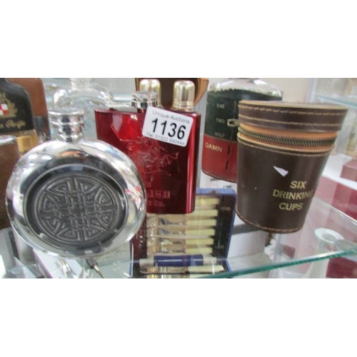 1136 - A mixed lot of hip flasks, advertising tumblers etc.,