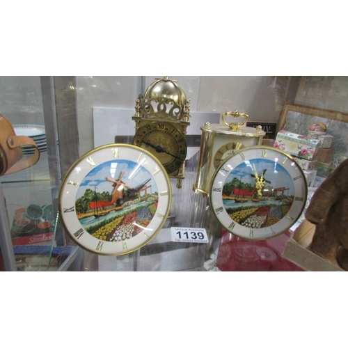 1139 - Two small mantel clocks depicting windmills, a battery lantern clock and a battery carriage clock.