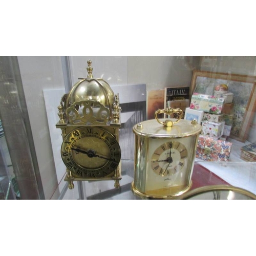 1139 - Two small mantel clocks depicting windmills, a battery lantern clock and a battery carriage clock.