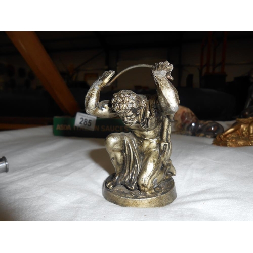 285 - A pair of gilded resin cherub candlesticks, trinket box, marble lion, white metal items, and the lit... 