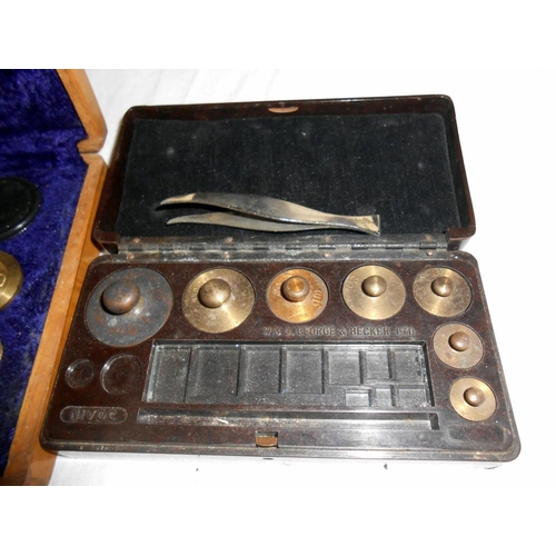 294 - A wood cased postal scales and weights and a case of weights