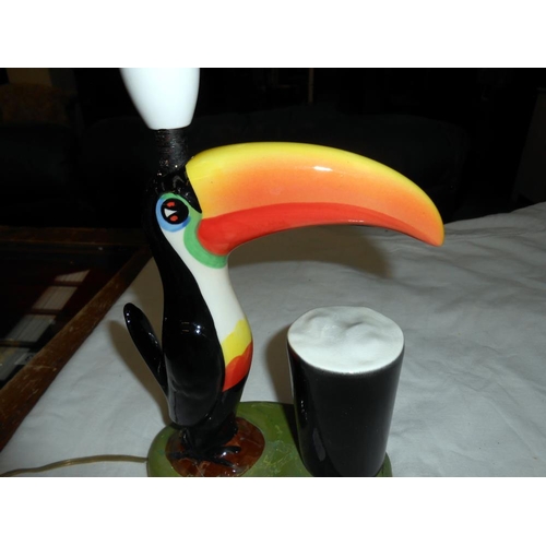 302 - A Carlton Ware Guinness Toucan table lamp, base damaged and repaired, needs re-wiring