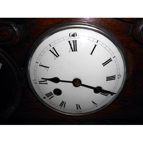 303 - A 1930's oak 8 day mantle clock with enamel dial