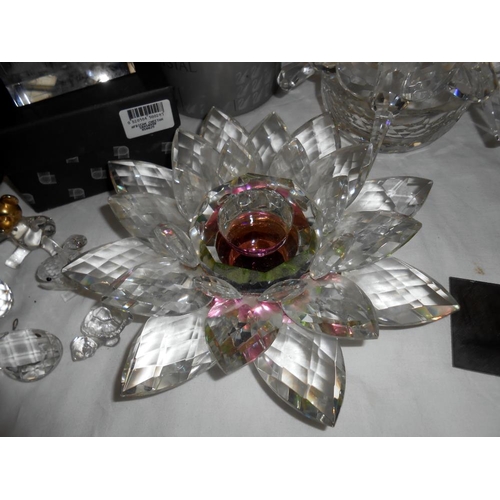 305 - 2 glass candle holders in good condition and a quantity of Swarovski, (all a/f)