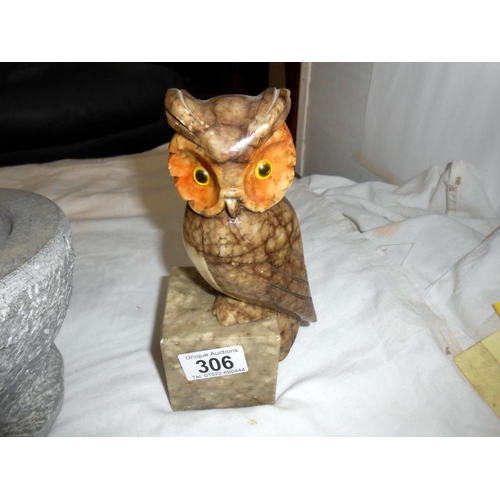 306 - A pair of polished stone owl bookends (ears a/f) and a heavy stone pestle and mortar