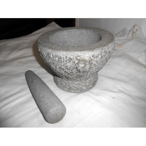 306 - A pair of polished stone owl bookends (ears a/f) and a heavy stone pestle and mortar