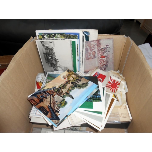 308 - A box of ephemera including vintage postcards and photgraphs, cigarette cards and a quantity of ciga... 