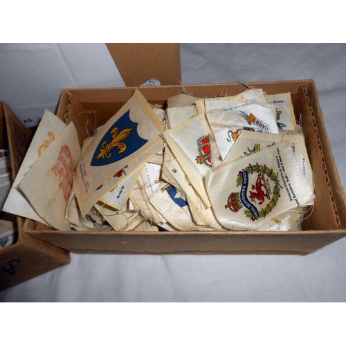 308 - A box of ephemera including vintage postcards and photgraphs, cigarette cards and a quantity of ciga... 