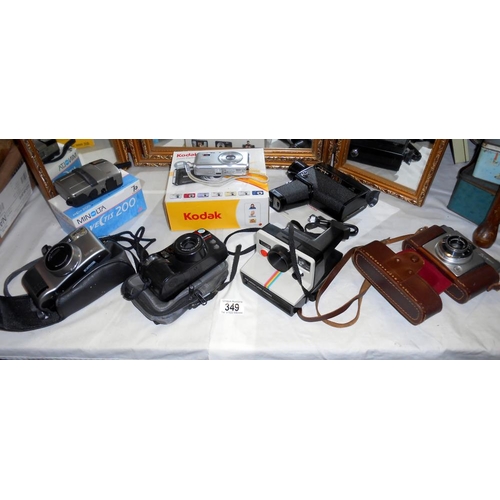 349 - A quantity of various cameras including Kodak, Minolta 200, Ilford Sportsman, Polaroid, Olympus 110,... 