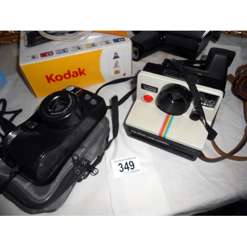 349 - A quantity of various cameras including Kodak, Minolta 200, Ilford Sportsman, Polaroid, Olympus 110,... 