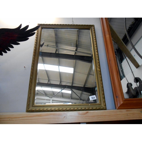 364 - A wooden framed mirror, slight a/f to frame size 67.5cm x 48cm - collect only