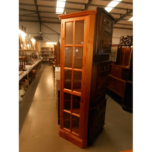 383 - A solid pine corner cupboard height 201cm, width at widest 57cm, depth 37.5cm approx.