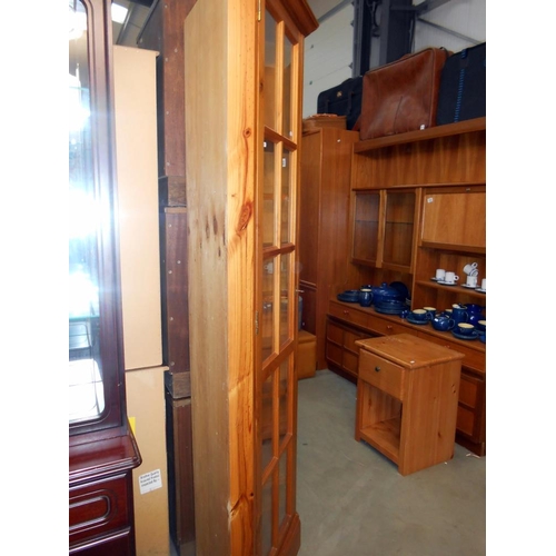 383 - A solid pine corner cupboard height 201cm, width at widest 57cm, depth 37.5cm approx.