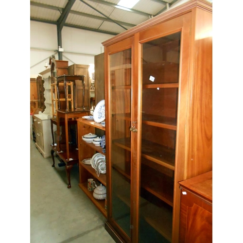 395 - A solid mahogany 2 door glazed bookcase, 5 shelves, with key, height 186.5cm, width 95cm, approx.