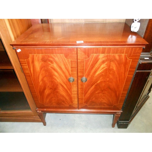 396 - A mahogany finished 2 door cupboard with crossbanded string inlaid doors A/F (please see photos for ... 