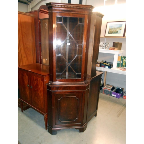 397 - A mahogany corner cupboard with astragal glazed door and cupboard base with 1 key, height 183cm, wid... 