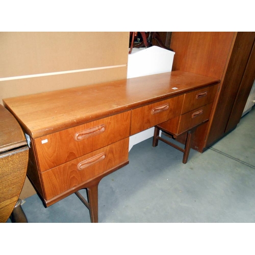 399 - A 1970's teak sideboard, height 75cm, width 150cm