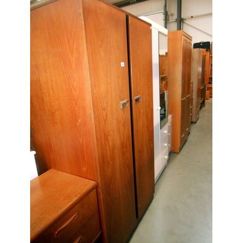 400 - A Gents 2 door teak wardrobe with half hanging on one side and 4 shelves, tie rack, stud holder and ... 