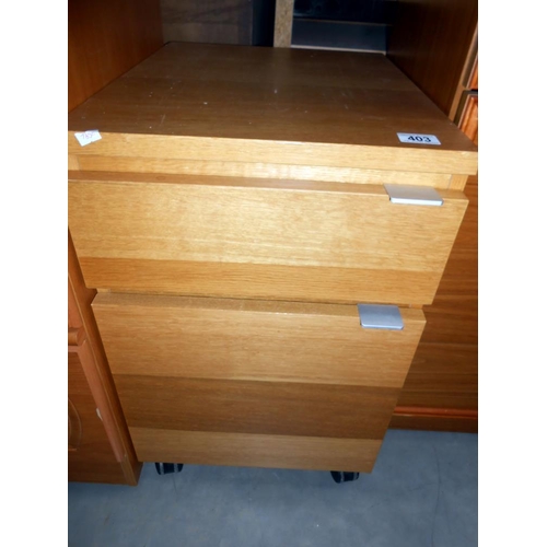 403 - An oak effect office 2 drawer filing chest, Height 53cm, width 40cm, depth 52cm approx.