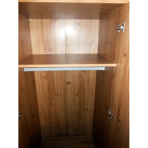 406 - A modern 2 door 2 drawer pine effect wardrobe, height 181cm, width 67cm, approx.