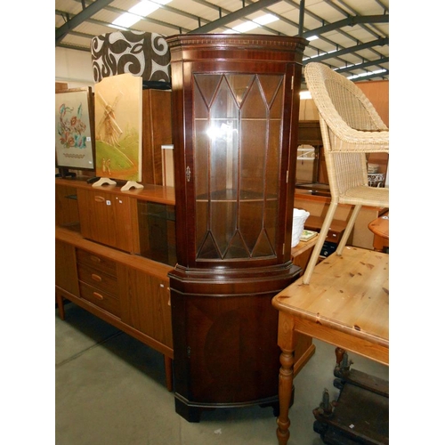 409 - A mahogany astragal glazed corner cupboard with dental cornice, with 1 key, height 179.5cm, width at... 