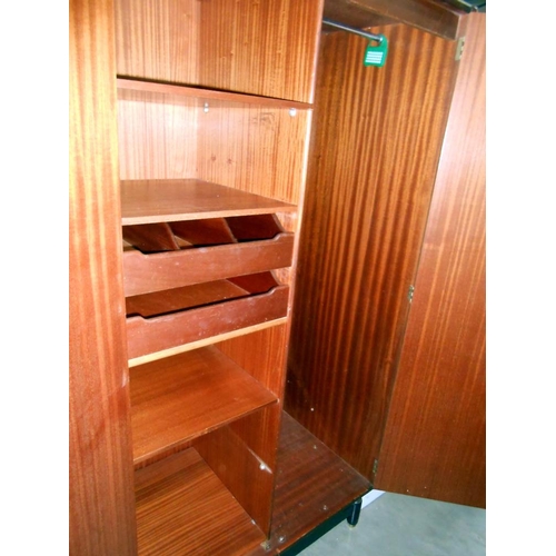 413 - A G Plan Gents double wardrobe with 4 shelves and 2 drawers on left side, height 168cm, width 92cm a... 