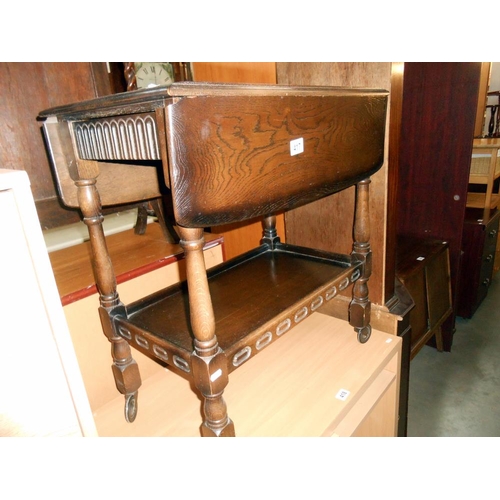 417 - A 1930's oak drop side tea trolley, height 74cm, width 68cm, approx.