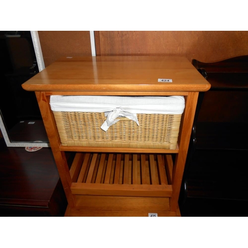 424 - A pine bathroom unit with a wicker drawer, height 59cm, width 51cm approx.