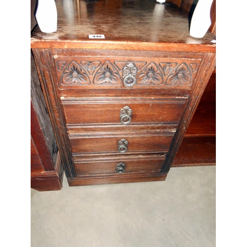 440 - An oak narrow 4 drawer chest of drawers, height 73cm, width 49.5cm approx.