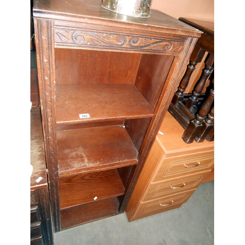 442 - An oak bookcase, height 127cm, width 49.5cm approx.