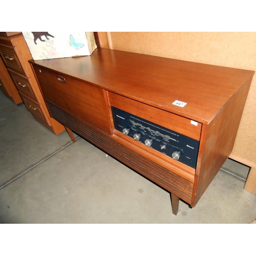 447 - A retro teak effect Westminster record player radio radiogramme, height 66cm, length 117cm approx.