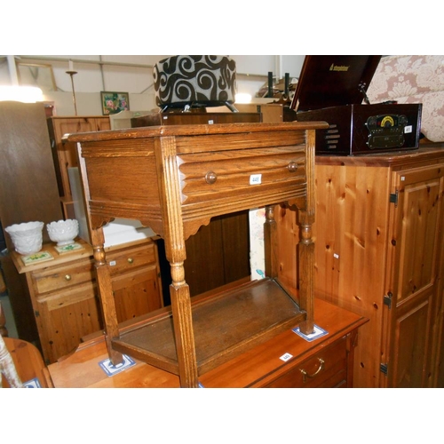 448 - A medium oak wall table with drawer and under shelf, height 72cm, width at widest 80cm approx.