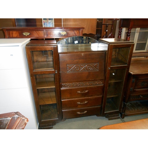 457 - A 1930's oak bureau with side bookcases with art deco cut glass panels, height 122cm, width 121cm ap... 