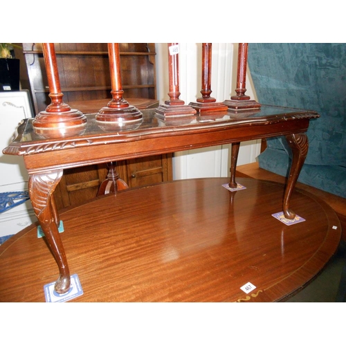 466 - A glass topped dark oak stained long coffee table, Height 43cm, top 96cm x 47cm