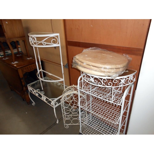 472 - A quantity of painted wrought iron glass topped tables, toilet seats and vegetable racks etc, in var... 