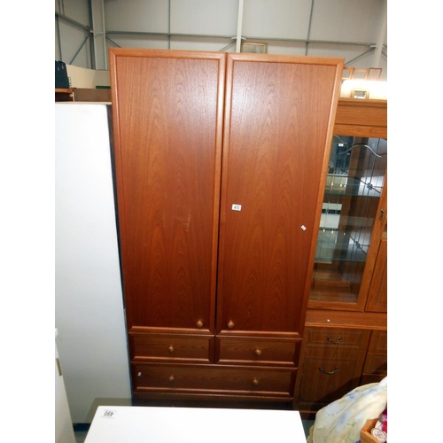 473 - A G-Plan teak 2 door wardrobe on 3 drawers, height 203cm, width 90cm, approx.