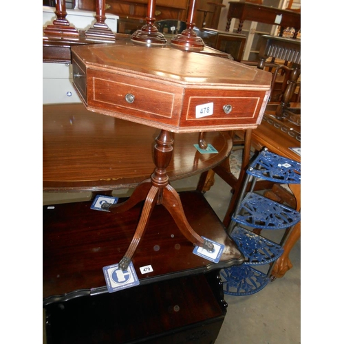 478 - A leather topped octagon drum table on 4 reeded legs, 8 drawers, 4 of which are fake, 1 knob loose a... 