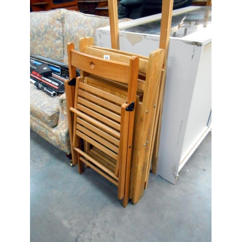 508 - 4 folding wooden chairs