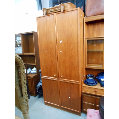 522 - A teak effect gents wardrobe, left side for shirts/trousers (2 hanging sections) right side has shel... 