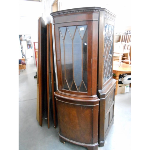 529 - A dark stained astragal glazed corner cabinet, height 182cm