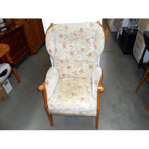 535 - A wood framed upholstered armchair