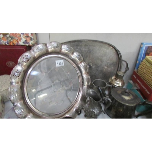 1155 - A mixed lot of silver plate including large trays, cruet sets etc.,